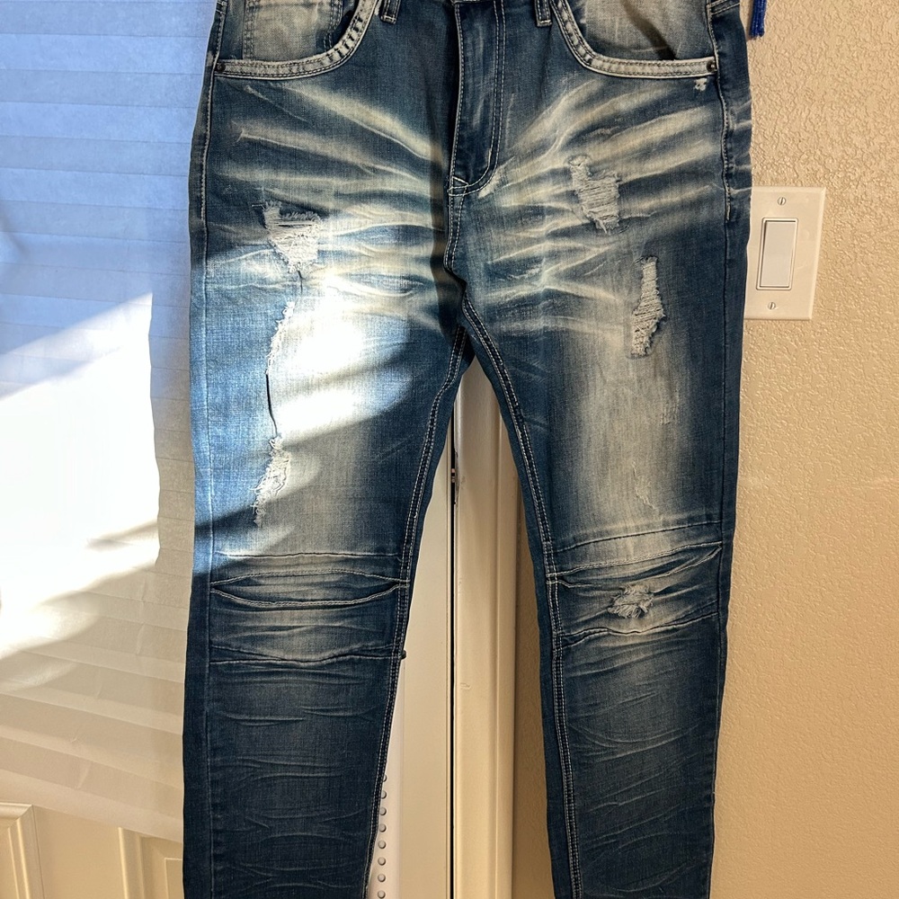 Distressed Blue Denim Jeans